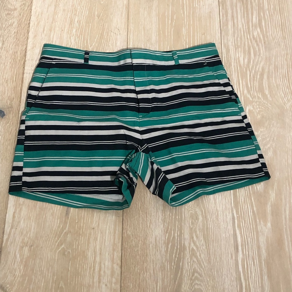 Like new! No stains or tears! Pockets in front sides and slit pockets inthe back